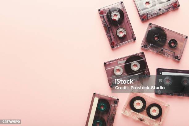 Vintage Audio Cassettes Border On Pink Background Stock Photo - Download Image Now - Audio Cassette, Videocassette, Adhesive Tape