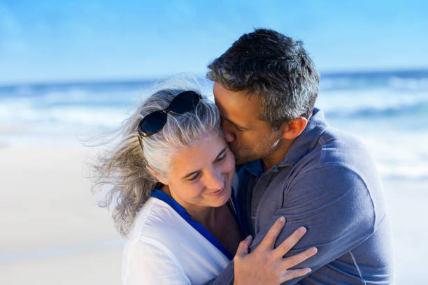 istock senior couple enjoying their vacation on the beach 925771302