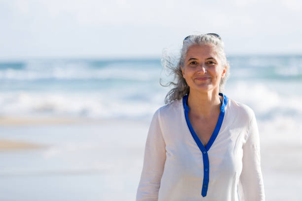 istock senior woman at the beach 925771454