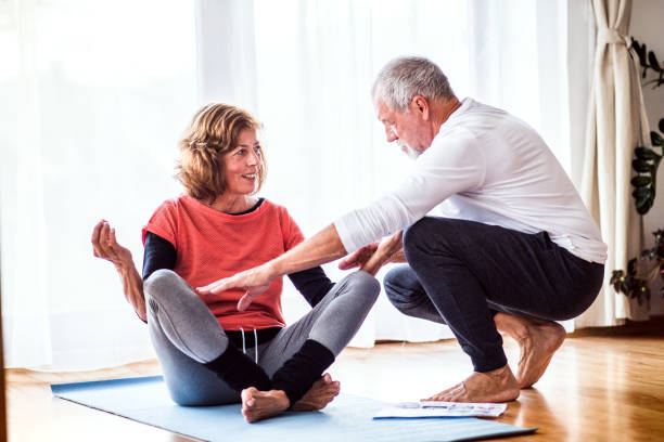 istock Senior couple doing exercise at home. 925771572