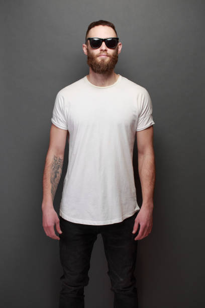istock Hipster handsome male model with beard wearing white blank t-shirt 925774478