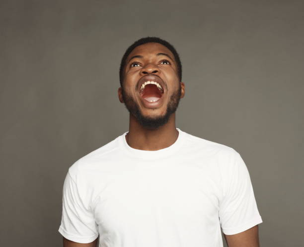 istock Black man expressing anger, feeling furious, shouting 925779750