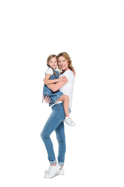 istock smiling mother holding happy daughter on hands, isolated on white 925783062