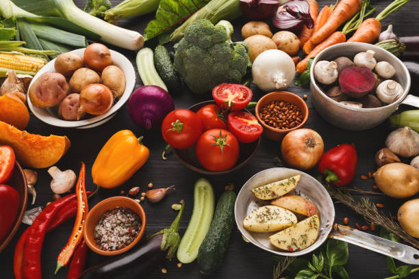 istock Fresh organic vegetables on wood background. 925783500