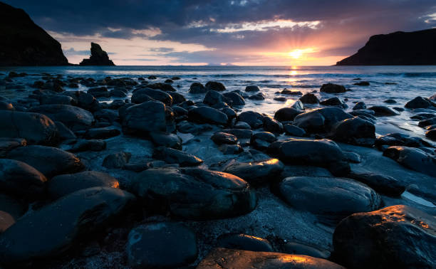 istock Black sands at Talisker Bay at sunset. 925786016