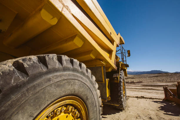 istock Dumper trucks parked on a construction site. 925786660