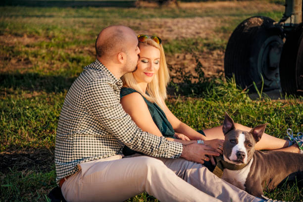istock Happy young couple and a pet 925792232