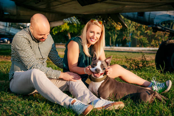 Happy young couple and a pet