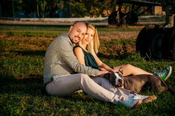 istock Happy young couple and a pet 925792682