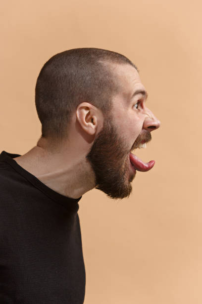 istock The young emotional angry, crazy man on pastel studio background 925804108