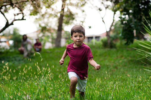 Child playing in the grass