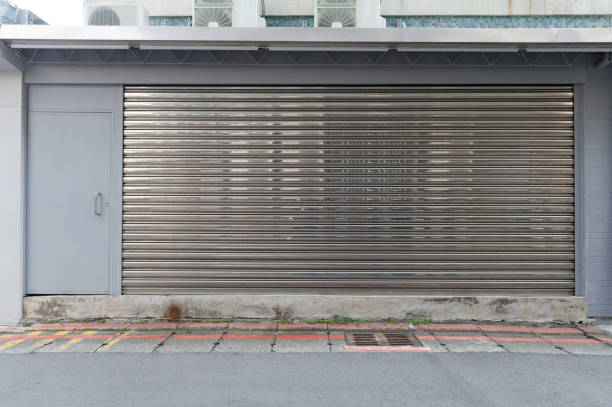 istock sidewalk by street wall & door 925815146