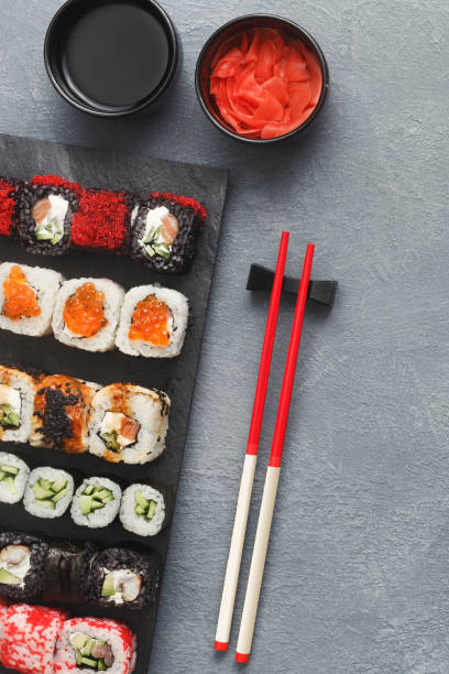 istock Set of sushi maki and rolls on grey background 925826024