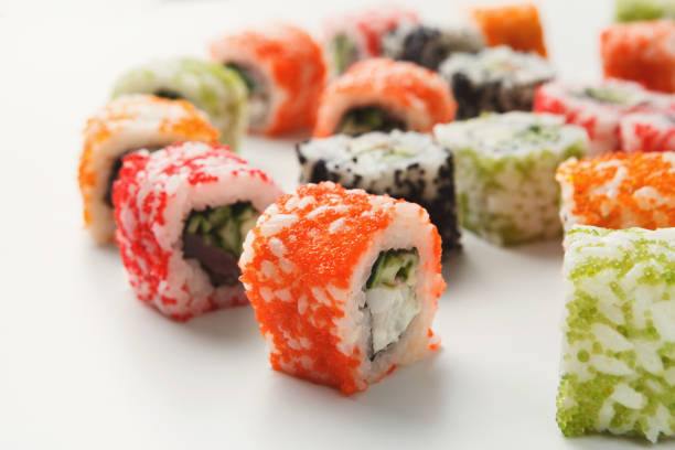 istock Closeup set of sushi rolls, on white background 925826214