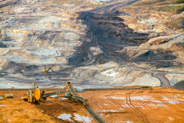 istock Part of a pit with big mining truck working 925826374