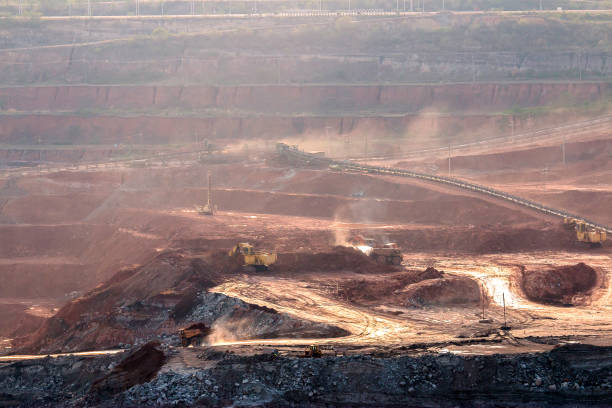 istock Part of a pit with big mining truck working 925826530