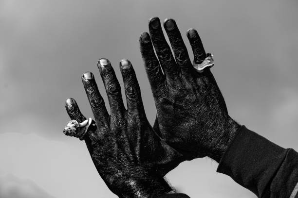 black man Hand with a shell in the sky