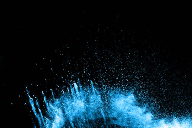 istock abstract blue dust explosion on  black background ,abstract blue powder splattered on black background , Freeze motion of blue powder exploding. 925828110