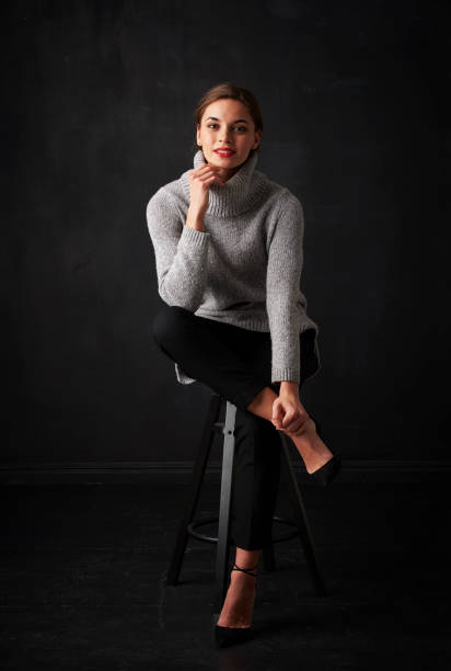 istock Relaxed young woman at dark background 925828200