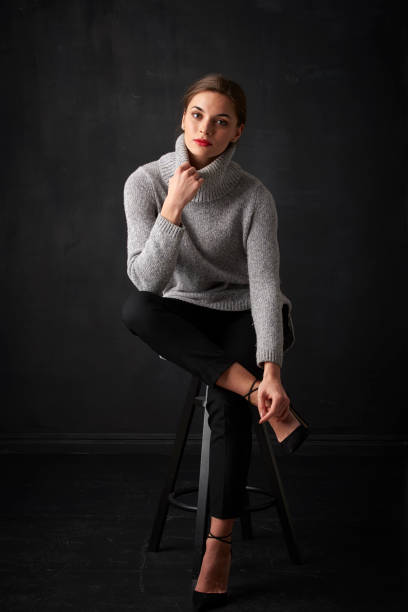 istock Relaxed young woman at dark background 925828202