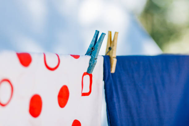 istock Close-Up Of Clothes Hanging On Clothesline 925830756