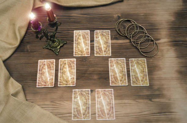 istock Foreteller. Future teller. Tarot cards on wooden table. 925830856