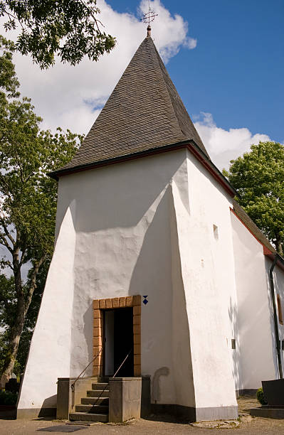 istock White chapel in nationalpark Eifel under blue sky 92583134
