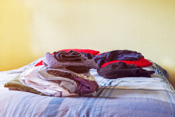 istock Real life, clean and dirty laundry over the bed 925833308