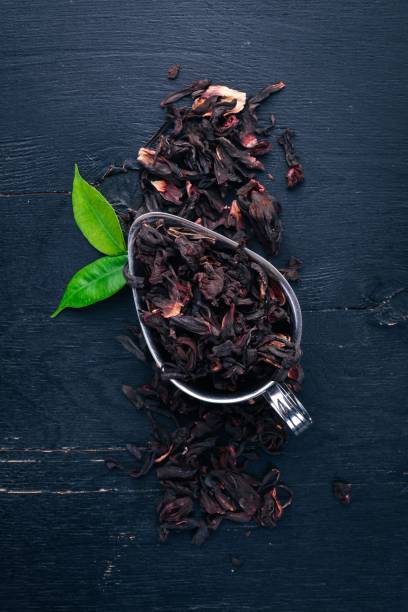 istock Dry Hibiscus tea. On a wooden background. Top view. Copy space. 925833538