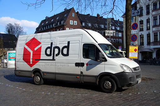 Düsseldorf, Germany - February 28, 2018: DPD (Dynamic Parcel Distribution) Iveco delivery truck parked by the side of the road. No people in the vehicle.