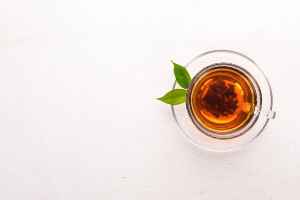 istock A cup of black tea on a wooden background. Top view. Copy space. 925839448