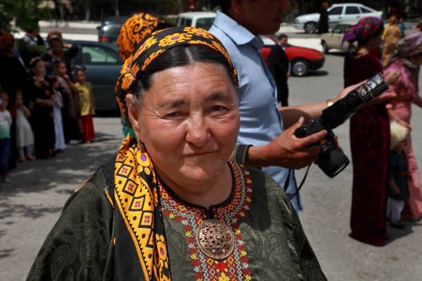 Kov-Ata, Turkmenistan - April 30, 2017: An unknown elderly woman in Turkmen national clothes. Kov-Ata, Turkmenistan - April 30, 2017