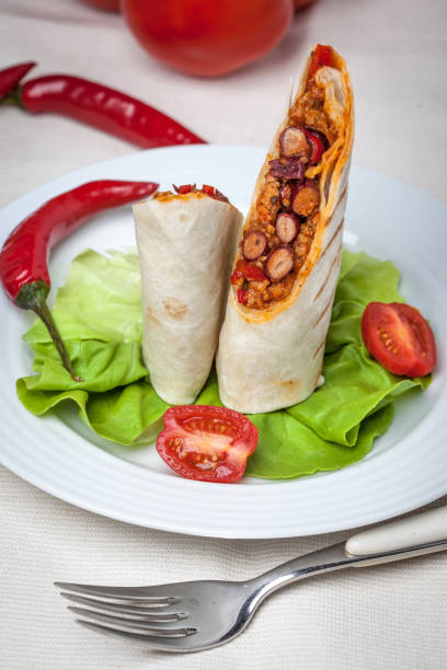 istock Burritos filled wiht minced meat, bean and vegetables. 925850102