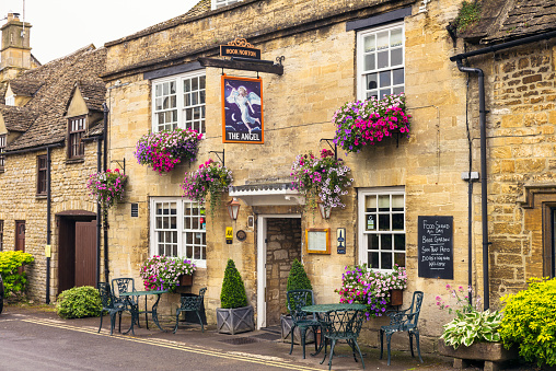 Burford, UK - The Angel, a traditional English pub in the old-fashioned village of Burford, in the Cotswolds.