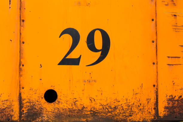 istock Number 29 on rusty orange metal sheet plate with hole 925853338