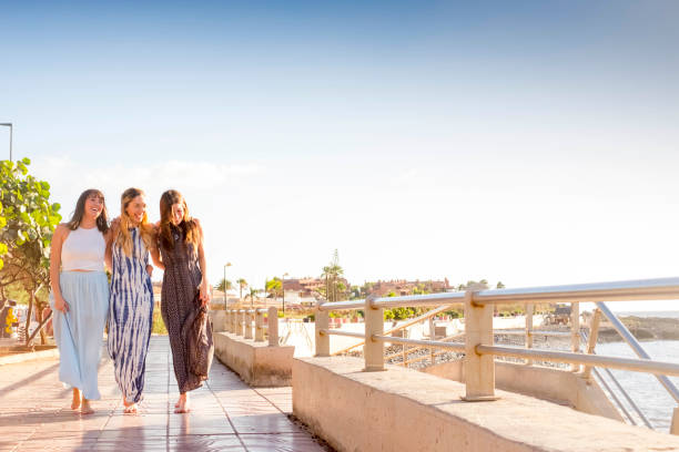 group of three young woman walking in vacation