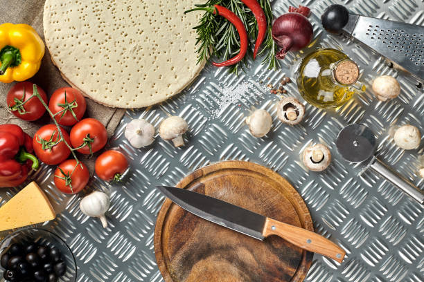 istock Ingredients for cooking pizza on metal table, top view 925864236