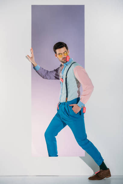 istock handsome man in stylish clothes with sale tags standing in frame on white 925865494