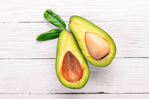 istock Avocado on a wooden background. Top view. Free space for your text. 925865776