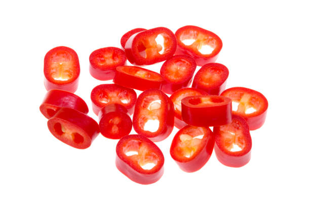 istock cut red hot chili peppers Capsicum on a white background 925865854