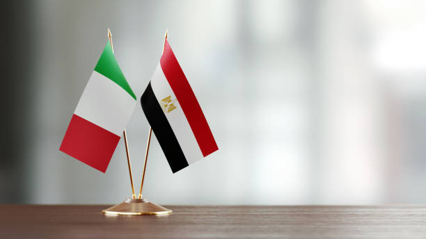 istock Italian And Egyptian Flag Pair On A Desk Over Defocused Background 925870668