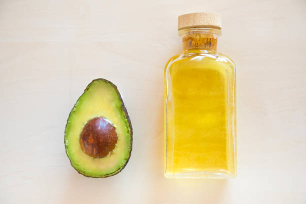 istock Fresh Avocado and oil in bottle 925877284