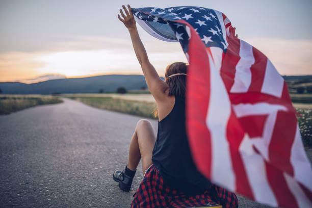istock Woman with an American flag 925877684