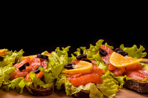 Fresh sandwiches with red fish and lettuce
