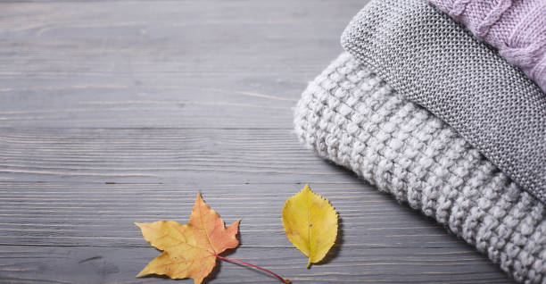 istock Autumn knitted sweaters and leaves 925897314
