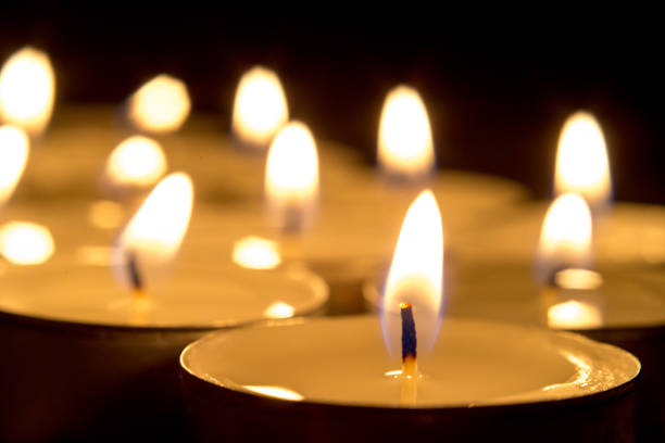 istock candle flames glowing in the dark. 925909408