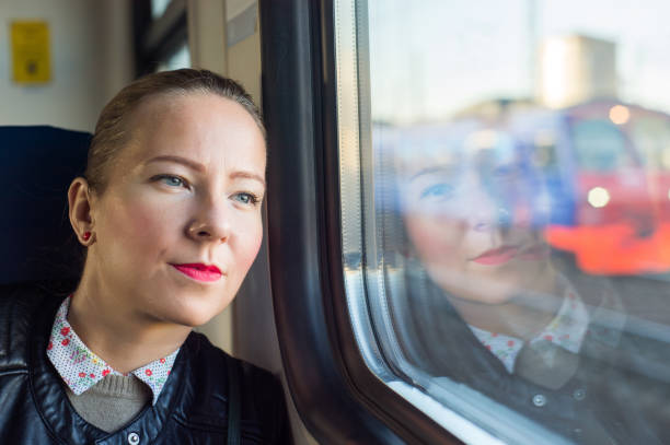 istock Young woman traveling by train 925910700