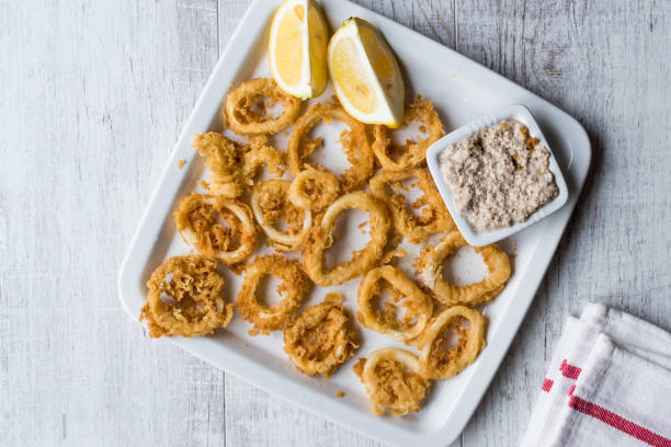 istock Fried Crispy Calamari Squid Rings with Tartar Sauce and Lemon. 925911622