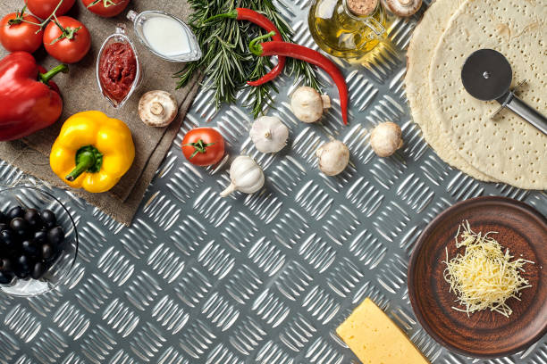 istock Cheese, different vegetables on metal table. Ingredients for traditional italian pizza 925911804