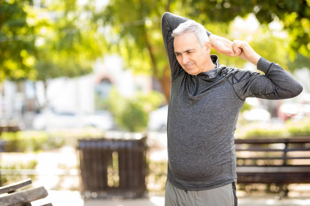 istock Active middle aged man working out in the park 925916356